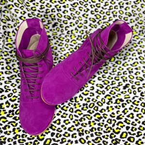 cyclamen leather ankle boots on a base of neon leopard pattern