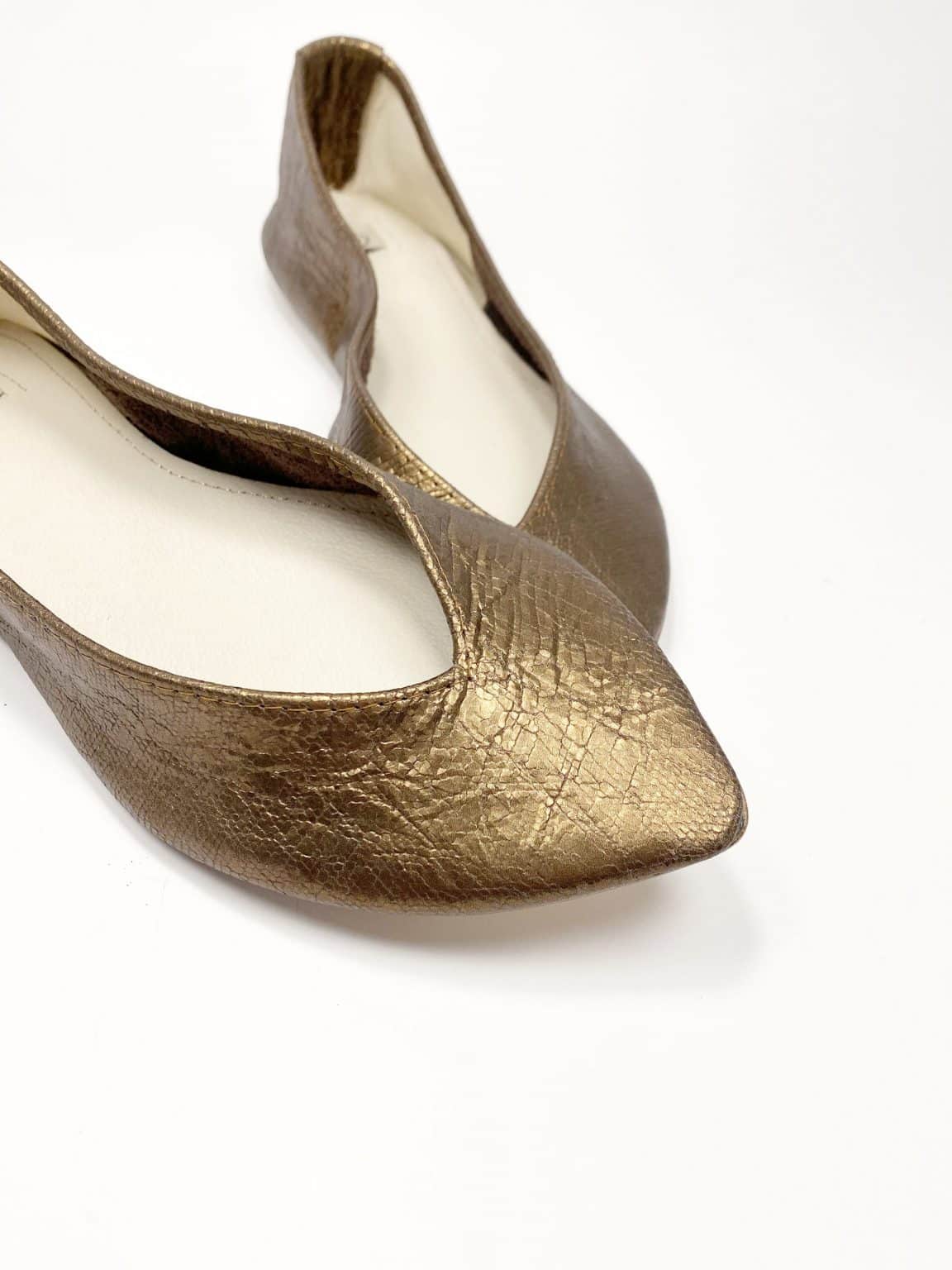 Close-up of pointed ballet flats in metallic golden bronze textured leather – elehandmade shoes