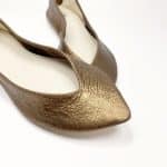 Close-up of pointed ballet flats in metallic golden bronze textured leather – elehandmade shoes