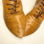 Women's camel tan leather ankle boots with pointed toe and lace-up design, handcrafted in Italy