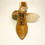 Women's camel tan leather ankle boots with pointed toe and lace-up design, handcrafted in Italy