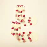 Sheer transparent socks with embroidered strawberries and red ruffled cuff