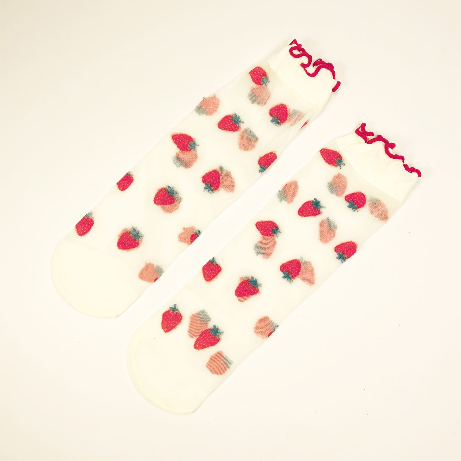 Sheer transparent socks with embroidered strawberries and red ruffled cuff