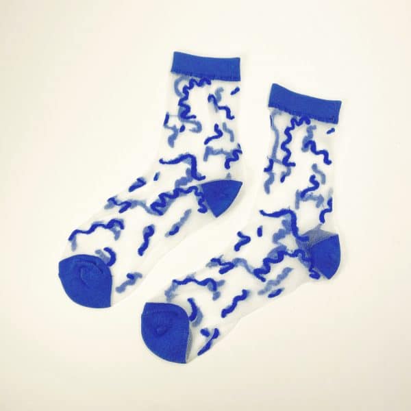 Pair of sheer socks with abstract blue squiggle lines and blue accents