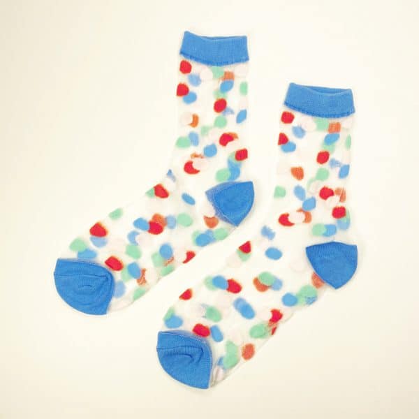 Pair of transparent mesh socks with multicolor dots and blue cuff toe and heel displayed flat