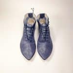 Top-down view of blue leather pointed-toe lace-up shoes, Italian handmade design