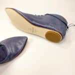 Side view of handmade blue leather lace-up shoes with leather sole, Italian craftsmanship