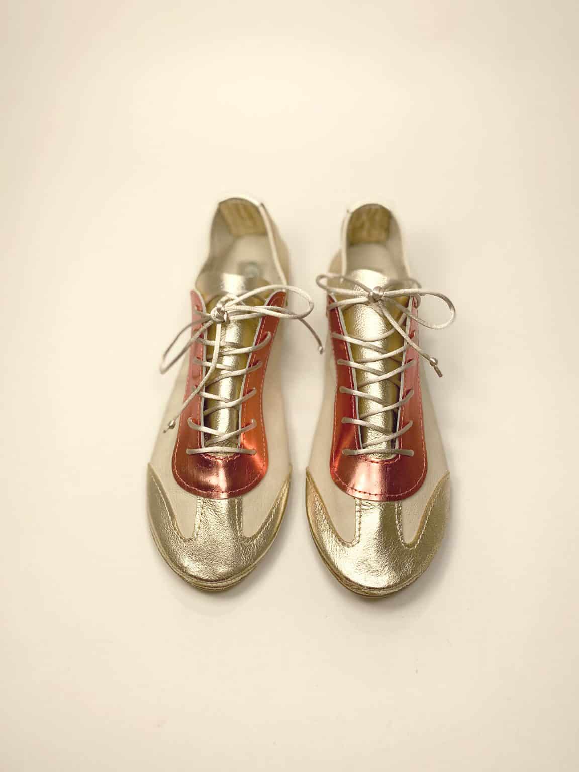 Handmade metallic gold and coral Italian leather trainers front view