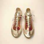 Handmade metallic gold and coral Italian leather trainers front view