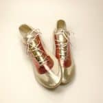 Handmade metallic gold and coral Italian leather trainers overhead angle