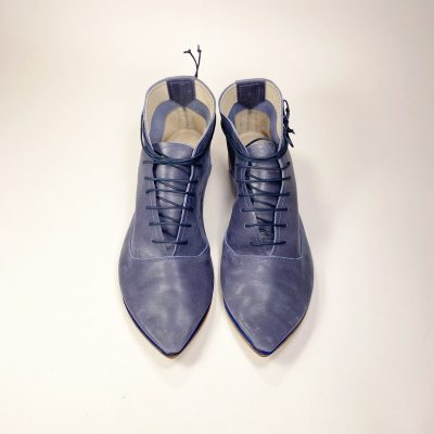 Top-down view of blue leather pointed-toe lace-up shoes, Italian handmade design