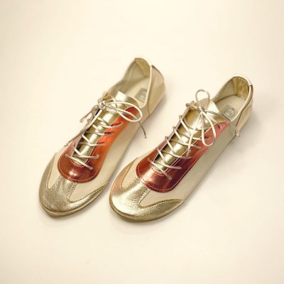 Retro Chic Trainers handmade in metallic gold and coral Italian leather side view